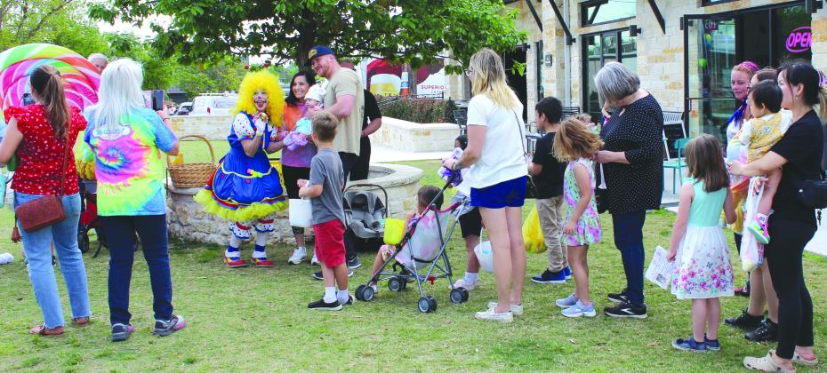 The 2024 Downtown Easter Egg Hunt on March 29 included families trekking from business to business around Main Street, collecting signatures from participating businesses and winning prizes and treats. Photos by Connie Swinney/The Highlander