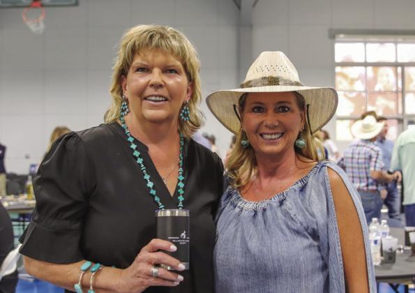 Community Resource Center's Mary Jo Callaway and Cynthia Green smiled for the camera April 27 at the Highland Lakes YMCA in Burnet at the Wags to Riches Hill Country Humane Society fundraiser.