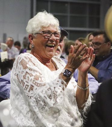 Sally Morgan clapped as she won the live auction National Rodeo tickets at the Wags to Riches Hill Country Humane Society Fundraiser Saturday April 27 at the Highland Lakes YMCA in Burnet.