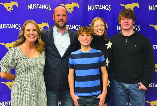 Pictured with Keri Timmerman, the new Marble Falls Independent School District athletic director and football head coach, are his family: Natalie, Brock, Addi and Doak. He was hired unanimously for the position Dec. 18. Jennifer Fierro/TexasChalkTalk.com