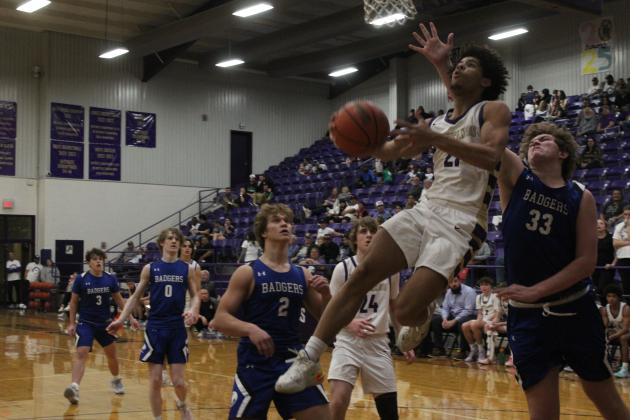 Marble Falls junior guard Tidus Willie scores 2 of his 19 points on this reverse lay-up against Lampasas. Photos by Jennifer Fierro/TexasChalkTalk.com