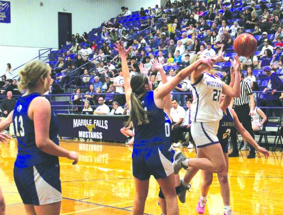 In a close game, giving up highpercentage shots is a no-no as Marble Falls junior forward Kylie Roberts finds out firsthand against Lampasas.