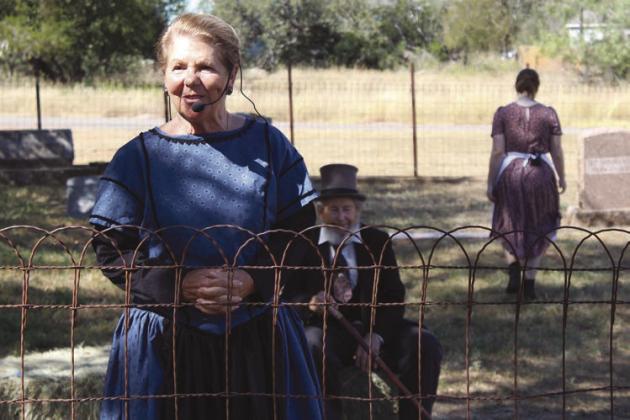 Francie Dix portrays one of the wives of the iconic legends at the actual cemetery of some of the settlers located in Cottonwood Shores.