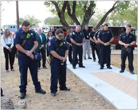 Members of the Marble Falls Fire Rescue and the Marble Falls Police Department recognized a solemn moment during the innocation at the Rotary Club 9/11 Ceremony at Johnson Park on Sept. 11.