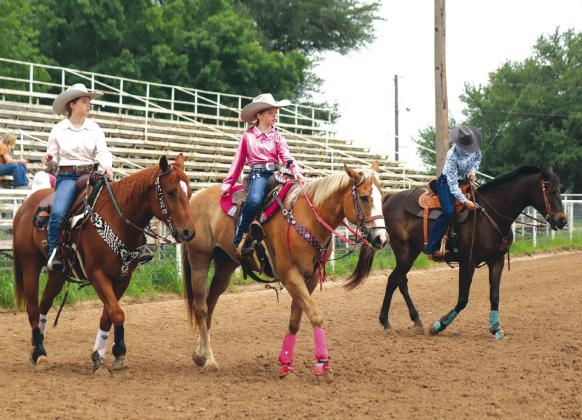 Saturday, May 4, at the Burnet County Rodeo Association 2024 Scholarship Pageant Addison Steele, Baylee Steele, and Harley Brady warmed up in the arena.