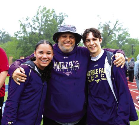 Marble Falls long jump and triple jump coach Jamie Graham (center) with freshman Madison Cuplin (left) and senior Cameron Graham, his son, at the Class 4A Region III meet.
