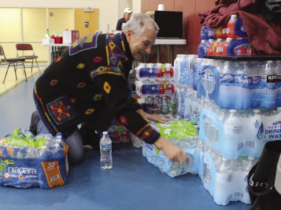 Lorinda Peters, a volunteer with Highland Lakes Crisis Network, coorganized donated water at First Methodist Church, set up as Warming Center Jan. 14-17.