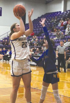 Marble Falls junior forward Bethany Fry helps shoulder the load near the basket with 7 points and 7 rebounds during the loss to Lago Vista.