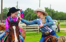 Jade Simon raised her hat for Trinity Frazier to apply more hairspray to keep her hat from flying off Saturday, May 4, at the Burnet County Rodeo Association 2024 Scholarship Pageant. See more photos on Page 14. Martelle Luedecke/Luedecke Photography