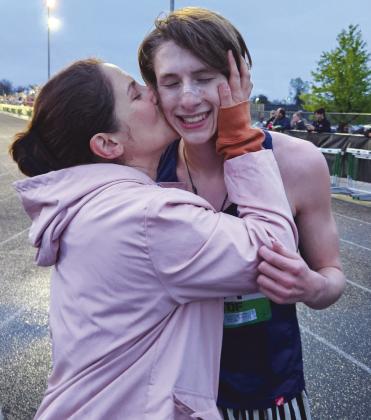 Marble Falls junior runner Tyler Hamblin is congratulated by his mother, Jennifer, after he competes at the Texas Distance Festival. His cheering section included his dad, Aaron, and sister Savannah. Contributed photo