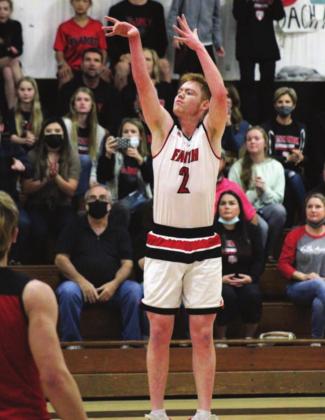 Flames senior Carter Slyker hit five threes in Tuesday’s playoff game against St. Paul of Shiner. In the early stages of the game, Slyker pulled up from 25 feet and knocked two of them down. Nathan Hendrix/The Highlander