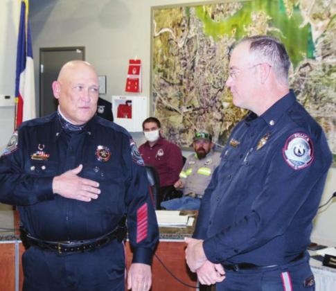 Horseshoe Bay Police Chief Rocky Wardlow, left, praises the work of his assistant chief, Jason Graham, who is celebrating 20 years of service to the city. Graham joined the department in October 2000 after graduating from police academy. 