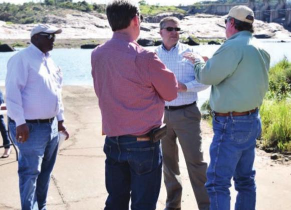 County and LCRA officials toured Wirtz Dam in 2017 and discussed a potential bridge crossing below the dam in Burnet County. On Tuesday, Aug. 25, the county signed a contract with KC Engineering to begin planning work on the Wirtz Dam Road project. File photo