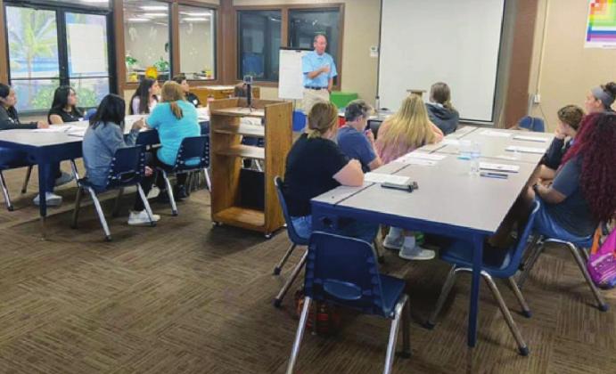 The decision to disallow children from using electronics while at the Boys and Girls Club was made by senior staff with the approval of Executive Director Bill Drake (seen here conducting staff training). Contributed