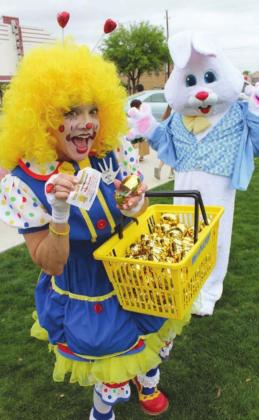 (Below) Ms. Lollip and the Easter bunny were on hand to greet, oblige with photos and guide participants on the hunt on April 15 which launched from Harmony Park.