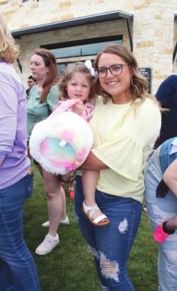 Bree Gonzales and little Sophia of Marble Falls collected prizes at the downtown Egg Scavenger Hunt on Good Friday.