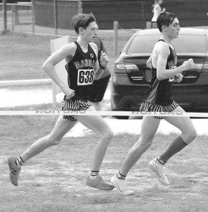 Tyler Hamblin (left) and Nick Dahl (right) push each other to improved times at Buda meet. Contributed photo
