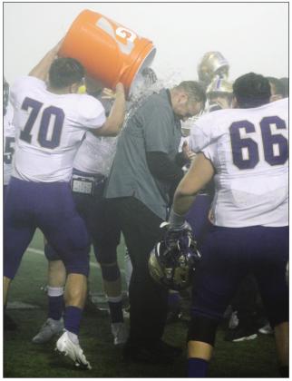 Mustang players Gabe Perez and Elijah Todd weren’t able to sneak up on Head Coach Brian Herman with the victory bath. Unfortunately, he saw them coming and braced for chilly impact. Herman started his postgame speech after the playoff win by reminding the players of his love for them.