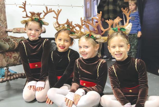 From left, Iceland reindeer Natalie Barclay, Leila Garcia, Blakelynn Gumbert, and Kate Nunnally awaited their entrance cue during the Gifts of Christmas dress rehearsal Dec. 2 at the Harmony School of Creative Arts. The show is Saturday, Dec. 9 at Hill Country Fellowship in Burnet.