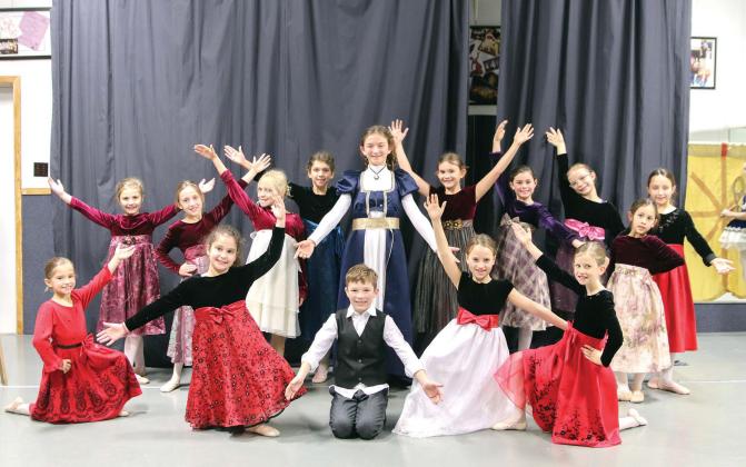Hayden Harton (Clara) and Sam Evans (Fritz) in their final pose after the “March of the Children” scene Dec. 2 during the dress rehearsal of Gifts of Christmas at the Harmony School of Creative Arts. Front row: Abigail Hansche, Sienna Belaj, Sam Evans, Salma Carmack, Elsie Pucek. Back row: Natalie Howlett, Zoei Grubbs, Harper Gumbert, Louisa Dudley, Hayden Harton, Georgia Terrell, Grace MacIntosh, Cora McCloughan, Whitney Nelson, and Joclynn Taylor.