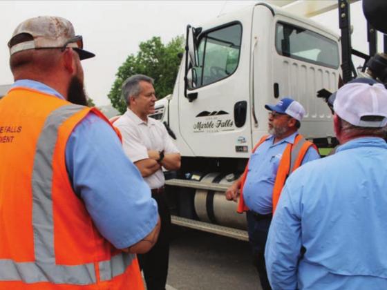 Left: Marble Falls City Councilman Craig Magerkurth discussed infrastructure with municipal crew members, including 26-year water department veteran Curtis Chelette, on a tour of city facilities after the meeting.