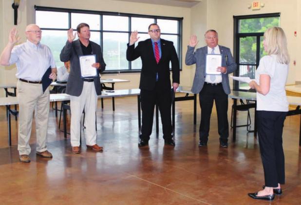 Marble Falls City Council members were sworn in this morning May 11 at Lakeside Pavilion. Council members (from left) Dave Rhodes and Reed Norman were re-elected. Challenger Bryan Walker is new to the board, and incumbent Councilman Richard Westerman was sworn in as the new mayor. Connie Swinney/The Highlander