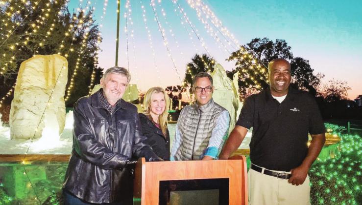 Horseshoe Bay Resort recently celebrated the 10th anniversary of Christmas lights. Pictured from left are: Horseshoe Bay Resort Vice Chairman and President Ron Lynn Mitchell, Director of Membership Stacey Persinger, Managing Director Bryan Woodward and Director of Grounds and Landscaping David Spells. Contributed