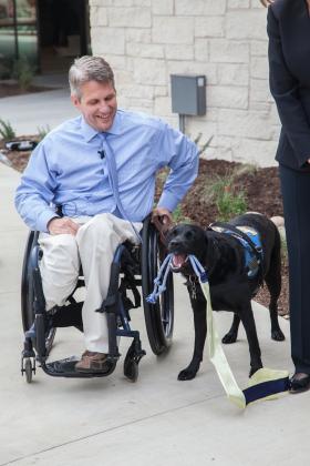 Baylor Scott and White Health, Texas’ largest not-for-profit health system, has been recognized for disability inclusion. Retired U.S. Air Force Staff Sgt. Jason Morgan and service dog Rue assist with a ribbon cutting ceremony at Canine Companions for Independence at Baylor Scott and White Health – Kinkeade Campus. Contributed