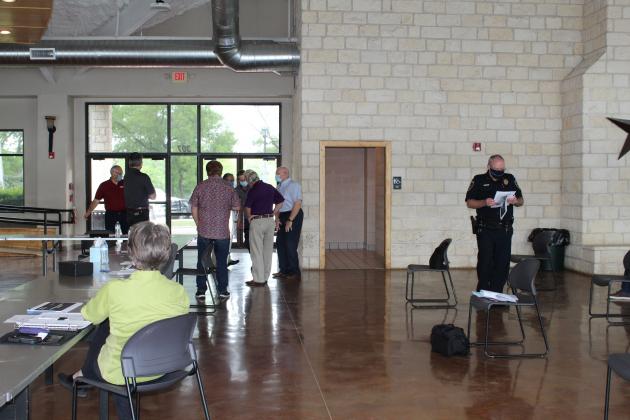 Back in May, Marble Falls City Council began hosting meetings (pictured here at Lakeside Pavilion) while social distancing and wearing face coverings. Despite an attempt by the council to encourage the wearing of masks but not require it with penalties for local businesses, Texas Governor Greg Abbott overrode local control of the mandate. File Photo