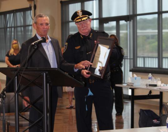 Marble Falls Police Chief Mark Whitacre – on behalf of the local police agency – accepted a certificate of recognition from the Retired Chief Bruce Mills of the Texas Police Chiefs Association Foundation. The lawman's speech applauded the department for its effectiveness and high standards for policing, reporting, public safety and investigations.