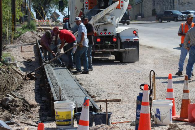City of Marble Falls crews poured cement for the start of several new parking spaces along Fourth Street – between Main Street and Avenue J in Marble Falls. The project was prompted by loss of parking spaces on Marble Falls EDC property off Third and Main to add green space adjacent to city hall. Connie Swinney/The Highlander