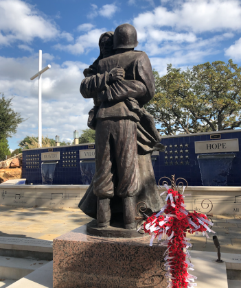 The Timothy Schmaltz statue, “Lest We Forget,” featuring Christ embracing an American soldier, is the centerpiece of the Armed Forces Honor Garden at St. Paul the Apostle Church in Horseshoe Bay. The church is inviting the public to tour the garden for Veterans Day. Contributed