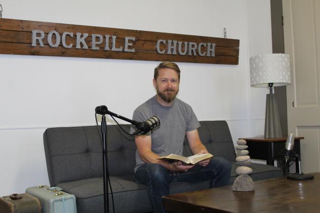 Matthew Netzer demonstrated his dedication to sharing the gospel as he offered his congregation options to hear worship services via radio broadcast, seen here in the spring. File photo
