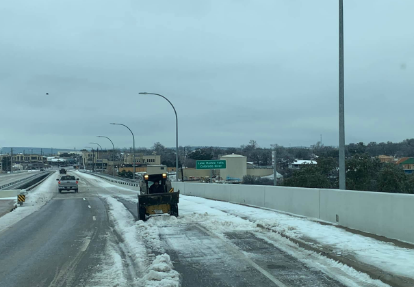 Two private citizens took it upon themselves to try to clear the way for safe travel on the US 281 bridge before authorities halted their activity and referred the de-icing duties to the Texas Department of Transportation.