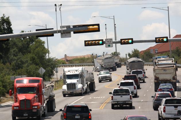 Large commercial truck make their way through the main roadways in Burnet County daily. The state AG's office was asked by local officials for an opinion about potential penalties for those  that violate weigh limit requirements on county roads. File photo