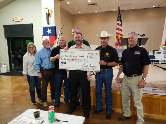 During the Friends of NRA banquet April 8 at Lakeside Pavilion in Marble Falls, Burnet County Sheriff’s Office were presented with a $2,800 grant from funds raised the previous year. Pictured, from right, are: Friends board member Pat Pucik, Investigator Robert Clark, Chief Deputy Mike Cummings, Capt. Steven Clark, Capt. Tom Dillard, Sheriff Calvin Boyd and Friends Chairman Mark McDonald. Contributed