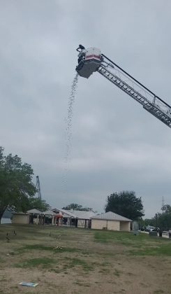 Marble Falls Fire Rescue lent a hand to the Highland Lakes Family Crisis Center with their inaugural Wednesday, April 28, Denim Day Ball Drop at Lakeside Park. HLFCC sold chances to win one of five prizes, with each chance represented by a golf ball that was dropped from a fire department ladder truck.