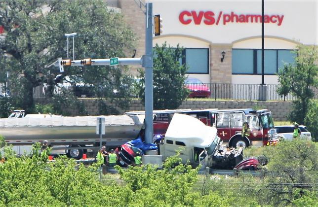 Motorists traveling onto or off FM 2147 saw this scene in the aftermath of the SUV and 18-wheeler collision on U.S. 281. Kelly McDuffie/Contributing Photographer