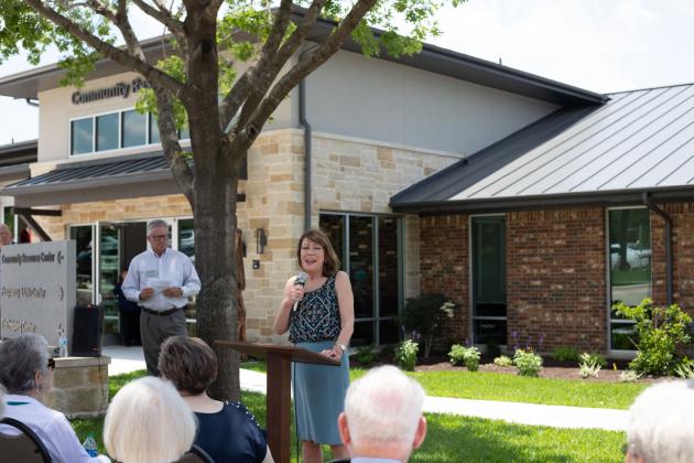 Texas Housing Foundation Senior VP Donna Klaeger and Capital Area Housing Finance Corporation president Mark Mayfield were among speakers at the event May 25 at the newly-renovated CRC facility.