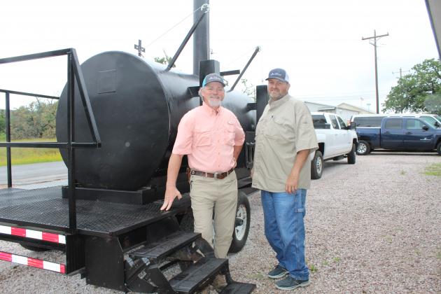 His Joshua House board member Scooter Sanders and Executive Director Robert Hall toured the donated barbecue pit for the Wild Game Dinner, scheduled for June 12. Connie Swinney/The Highlander