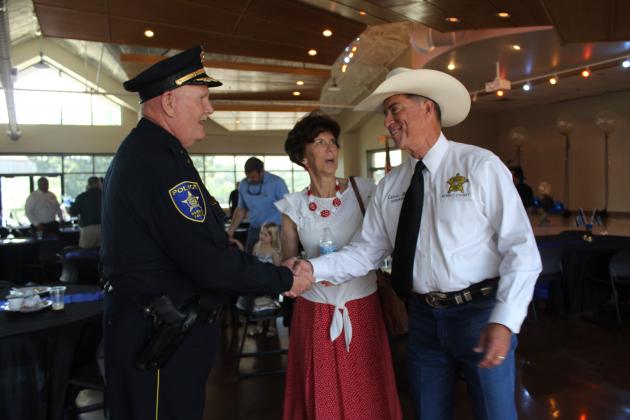 Burnet County Sheriff Calvin Boyd wished Whitacre and his wife Bonnie well during an event thanking him for his service. Photos by Connie Swinney/The Highlander