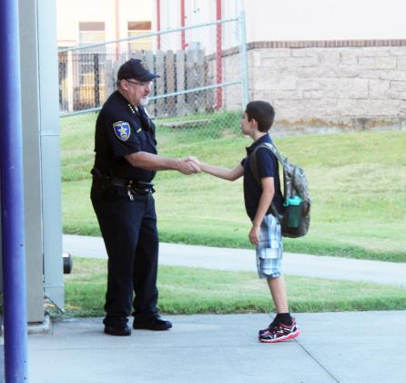 Marble Falls Police Chief Glenn Hanson greeted students today, Aug. 18, 2021, for the first day of school at Marble Falls Elementary School. Authorities are keeping close watch on school zones for safety.See more photos in the Friday, Aug. 20 issue of The Highlander. Nathan Hendricks/The Highlander