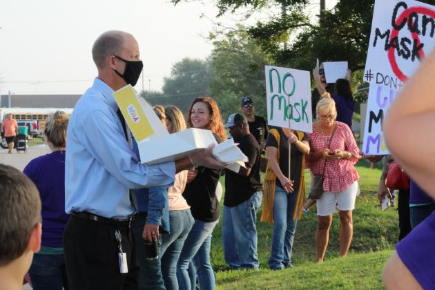 Marble Falls ISD Superintendent Chris Allen offered protesters donuts prior to the start of the rally.