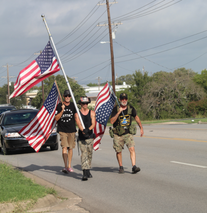 Kingsland-area residents, from left, Shawn McDaniel, Joshua Shirley and Dave Oxford marched 13 miles from Kingsland to Marble Falls Sept. 3 to make a statement about the 13 members of the armed forces who were killed recently in a suicide bombing attack in Afghanistan. Photos by Connie Swinney/The Highlander