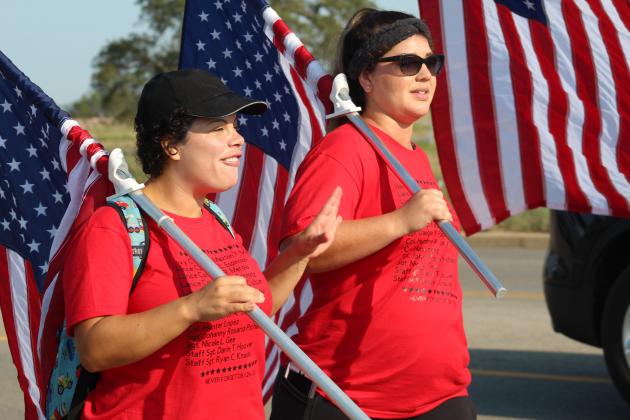Reservist Gislaine Delgado and Army veteran April Siezert, both Fort Hood residents, participated in the Patriot Day march with about a dozen other people on U.S. 281 for 13 miles.