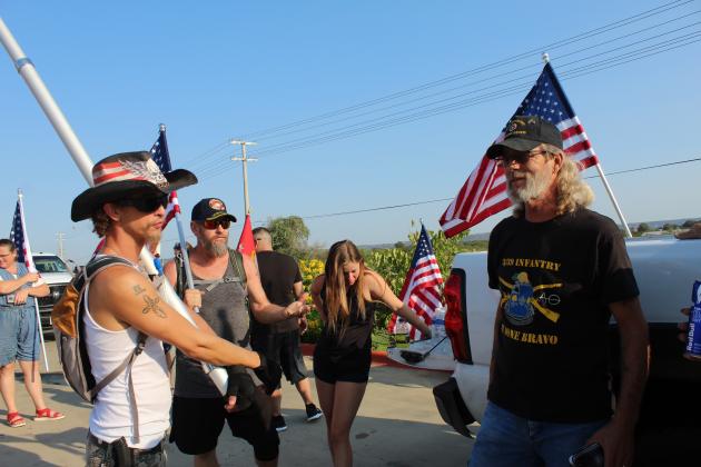 Josh Shirley (left) and Dave Oxford initially marched 13 miles from Kingsland to Marble Falls on Sept. 3 to honoring troops who died in a terrorist attack in Afghanistan in August. They rekindled interest in a second trek on Sept. 11 Patriot Day and coaxed more participants, including Marine veteran David Wright (center) of Horseshoe Bay.