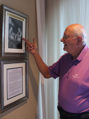 Horseshoe Bay resident Larry Niemann framed the photocopied pages of Captain William DeSanders’ diary along with photos of his aircraft. The dedication is on display at his home. Nathan Hendrix/The Highlander