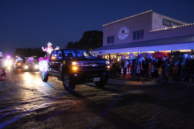 The Burnet County Rodeo Queen was featured on a float which trotted along Main Street in Marble Falls.