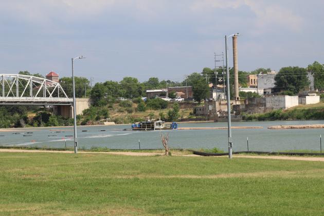 The city of Llano contracted with Collier Materials to utilize dredging barges (pictured here in 2020) to remove excess sediment washed into Town Lake during flooding. An amended dredge and fill ordinance drafted by LCRA will add designated zones for commercial dredging which consider factors such as public safety and impact on water supply. File photo