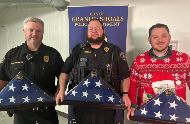 Officers Chad Taliaferro, Shane Mahoney and Allen Miley were awarded U.S. flags for their exemplary service during 2021.